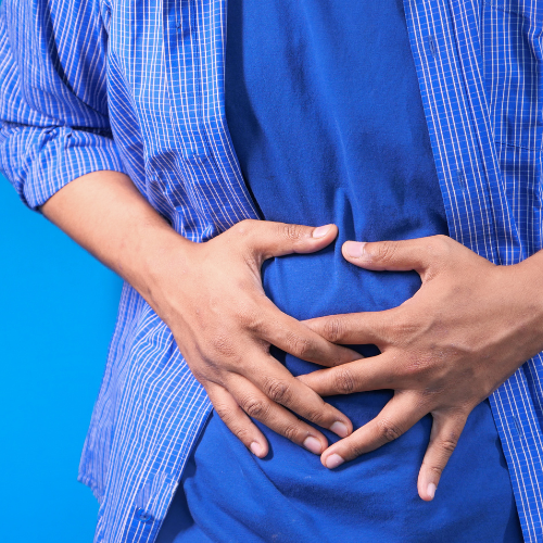 Pessoa com dor abdominal associada à obstrução intestinal